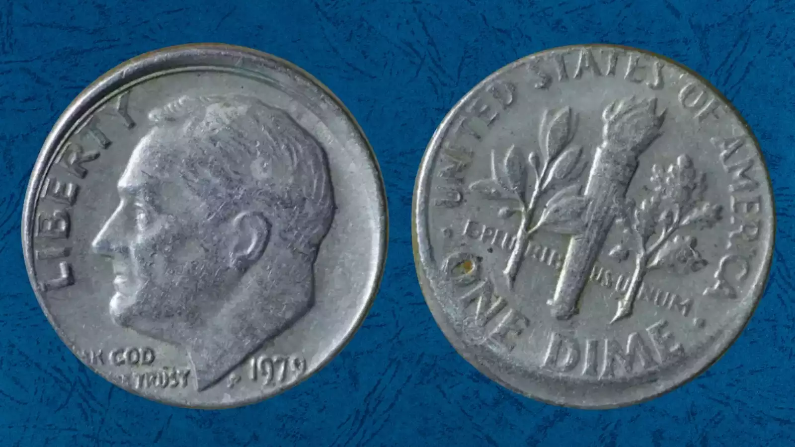 1979 Roosevelt dime off-center strike error showing partial design with blank crescent area and visible date